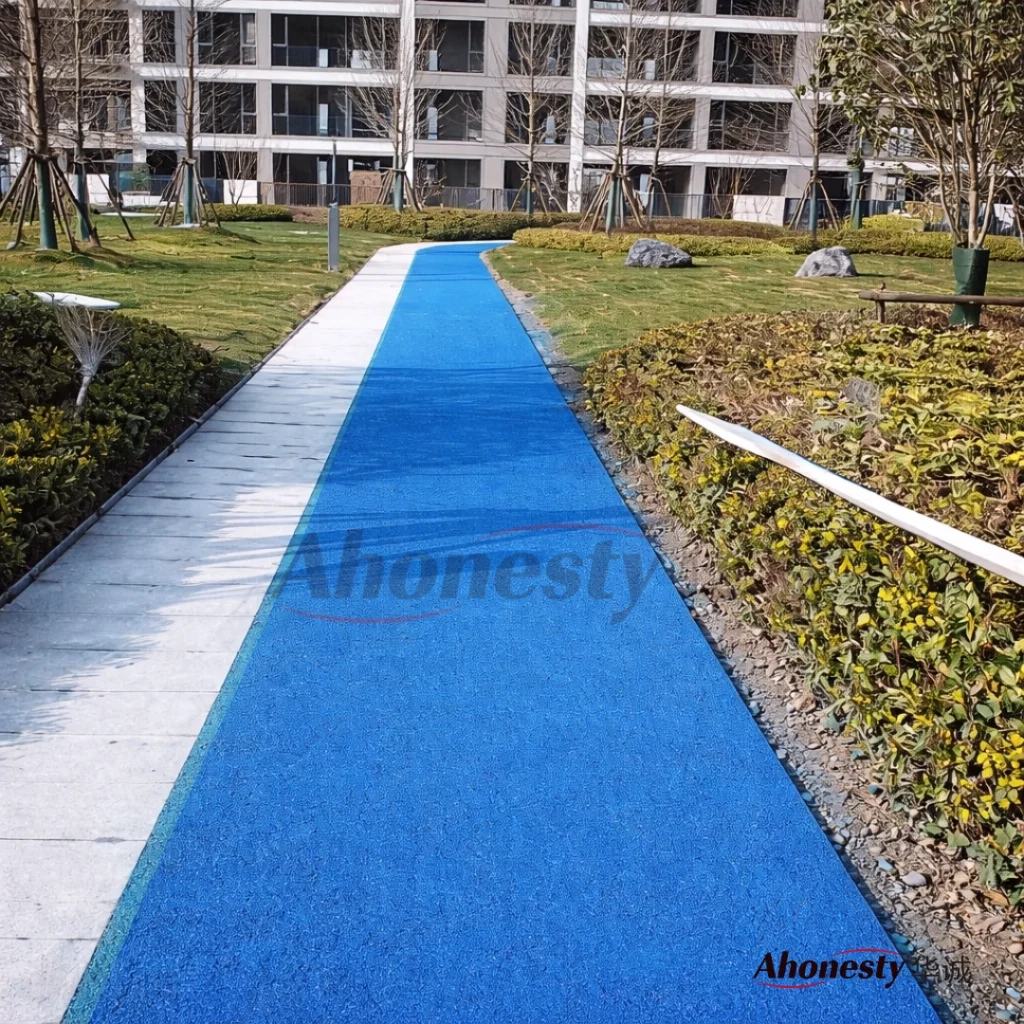Blue cold mix asphalt walkway applied in residential garden for pedestrian traffic
